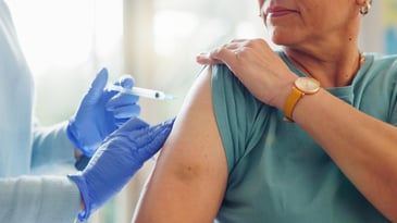 Woman receiving vaccine representing influenza week