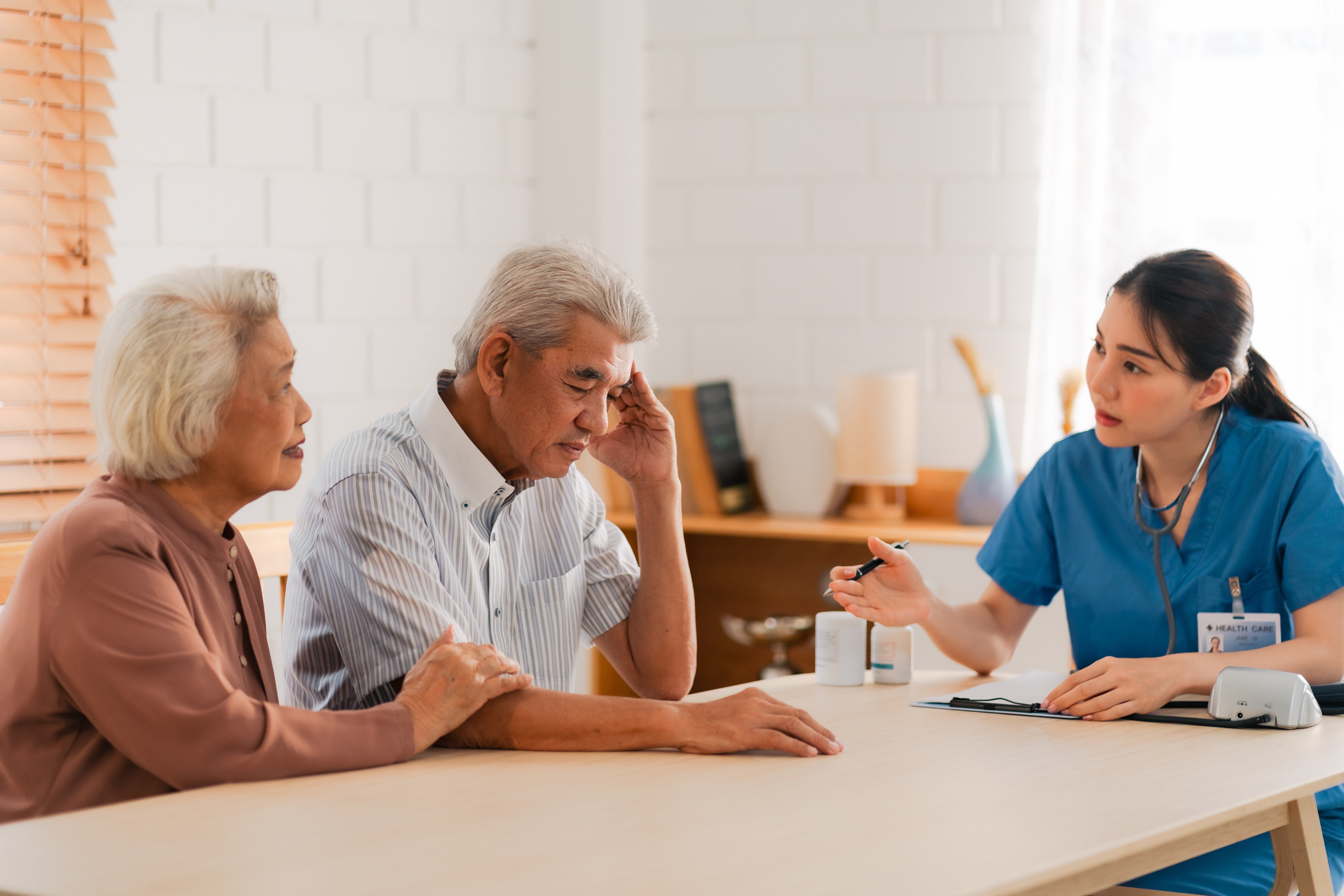 Couple talking to medical professional