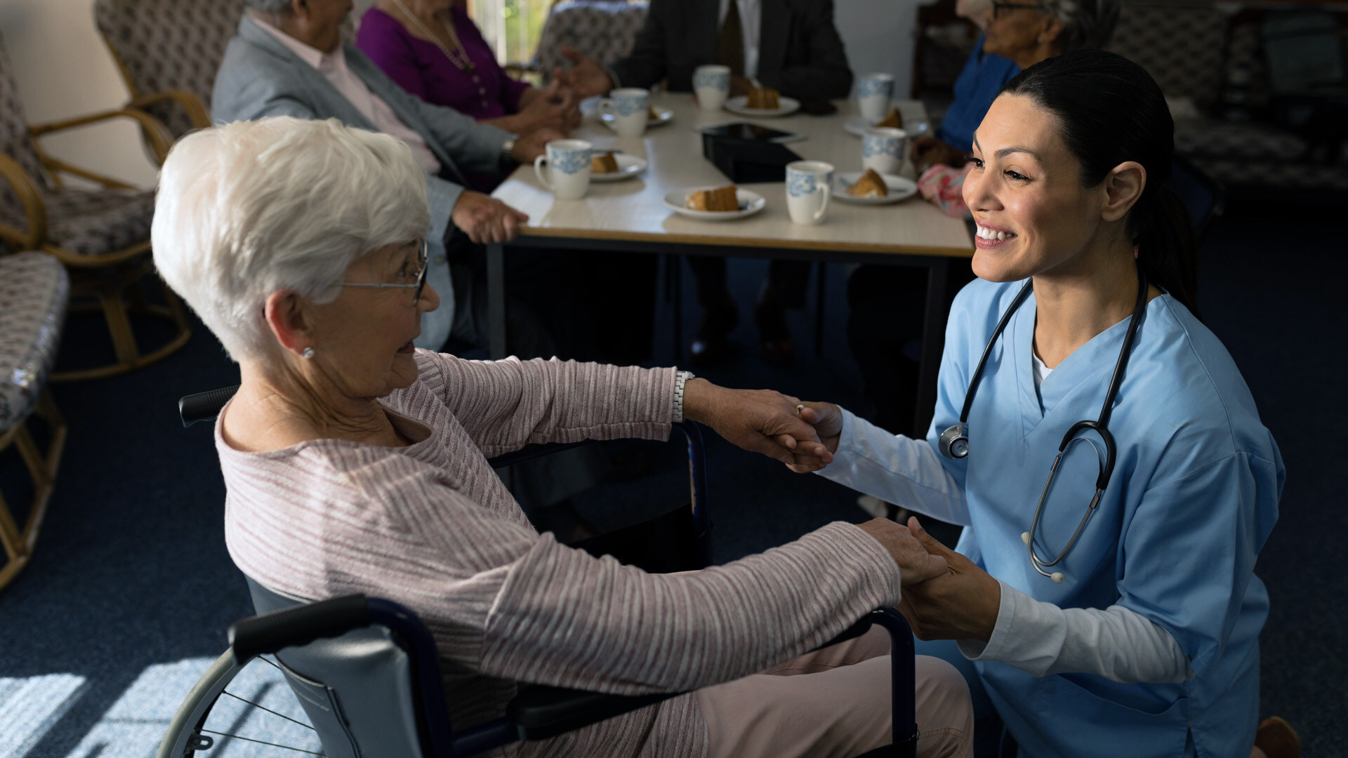 Nurse with senior in a wheelchair